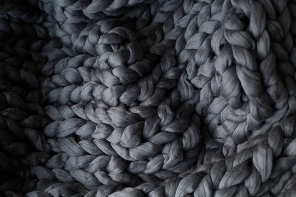 Coperta in maglia grigia close-up, fondo lana merino — Foto Stock