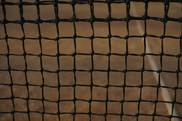 Tennis court black net closeup on the background of coverage
