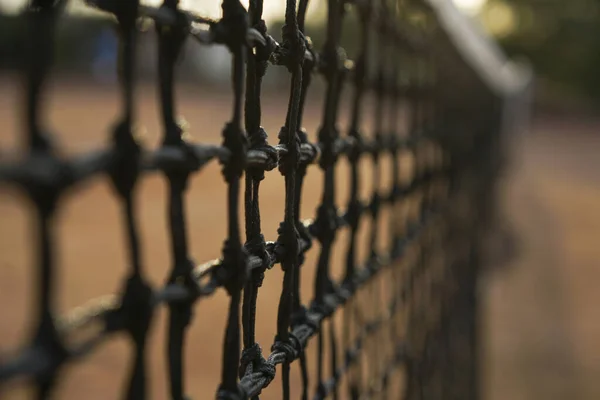 Tennis court black net closeup on the background of coverage