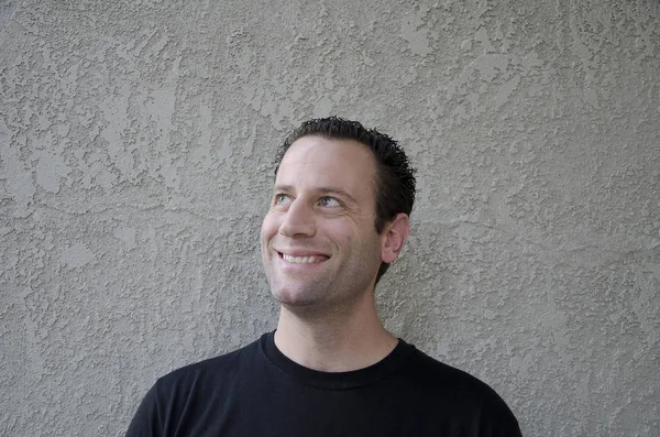 Curious man smiling looking upward. — Stock Photo, Image