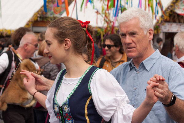 PRAGUE, CZECH REPUBLIC - APRIL 15, 2017: Easter at the Old Town Square - People in traditional Czech costumes teach tourists how to dance