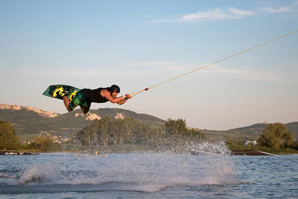 Rider wakeboarding in the cable wake park Merkur — Stock Photo, Image