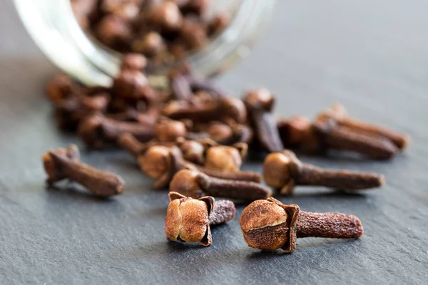 Dry cloves (spice) on a dark background — Stock Photo, Image