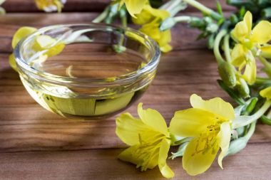 Evening primrose oil with evening primrose flowers clipart