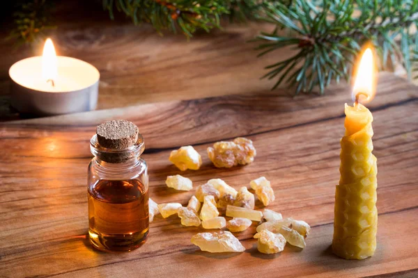 A bottle of frankincense essential oil with frankincense resin c — Stock Photo, Image