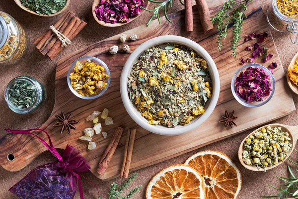 A mix of herbs on a wooden table, top view