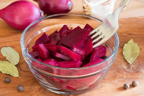 Fermented red beet in a bowl with a fork — Stock Photo, Image