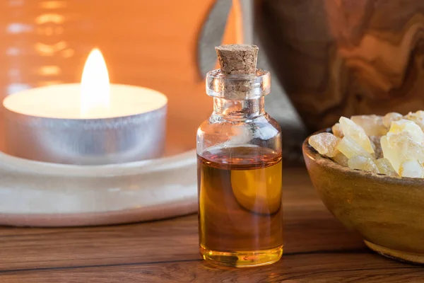 A bottle of frankincense essential oil with frankincense resin — Stock Photo, Image