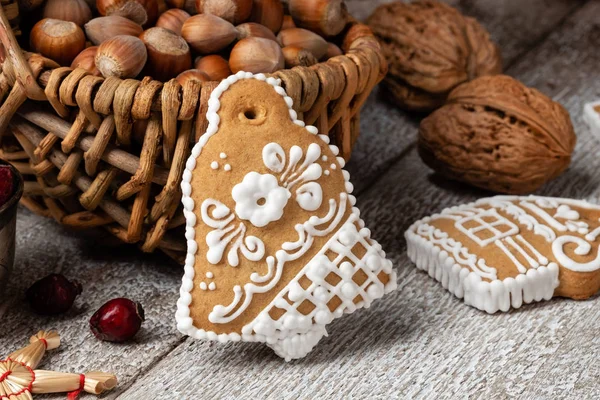 Bell shaped gingerbread Christmas cookie on a table — Stock Photo, Image