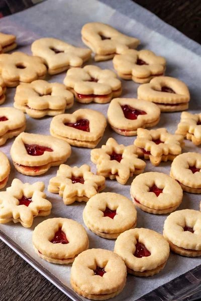 Linzer Christmas cookies filled with red currant marmalade Royalty Free Stock Photos