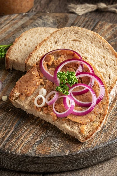 Slices of bread slathered with pork lard mixed with ground crack — Stock Photo, Image