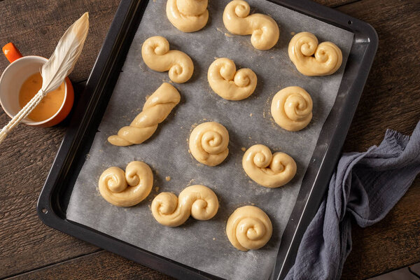 Raw jidasky or jidase - Czech sweet Easter pastry made of yeast dough, brushed with an egg before being baked
