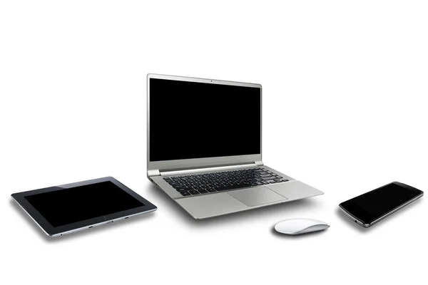 Ноутбук и устройство — стоковое фото