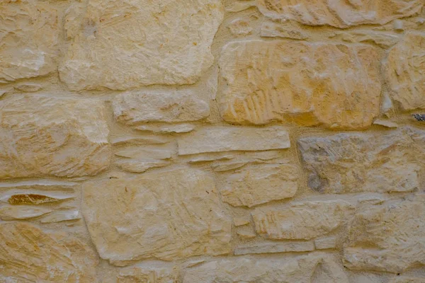Primer plano de la pared construida en piedra con patrón y textura . — Foto de Stock