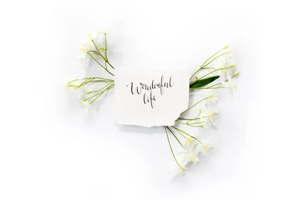 Minimalistic composition with words `Wonderful life` 