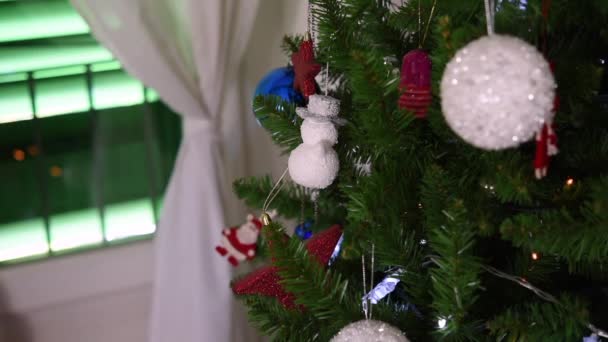 Video of Christmas decorations on the Christmas tree, selective focus — Stock Video