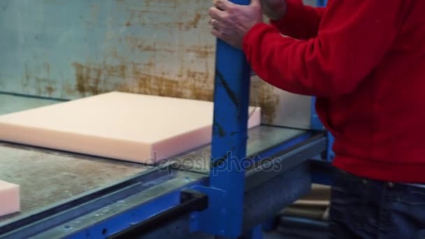 A man cutting foam rubber on the huge cutting machine, 4K — Stock Video