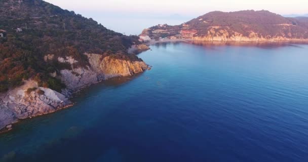 Aerial shot of beautiful sunset on the calm sea in Elba island in Tuscany, Italy, 4K — Stock Video