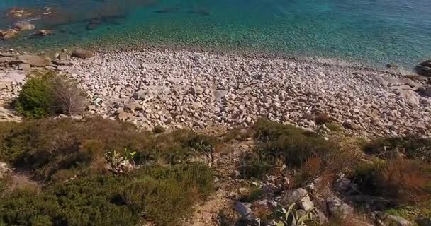 Aerial shot, beautiful transparent paradisiac sea and white stones on the shore in Elba island in Italy, 4K — Stock Video