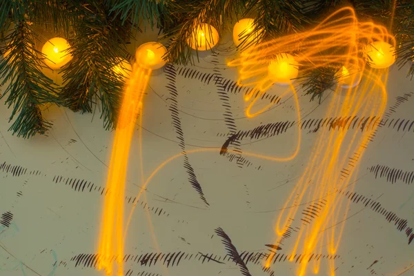 Light painting, lighted candles and fir branch on wooden boards — Φωτογραφία Αρχείου