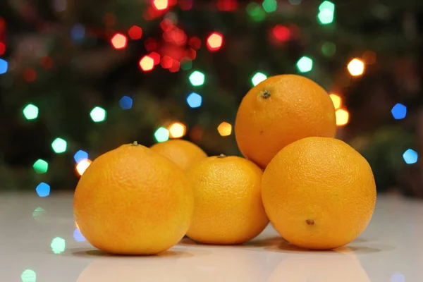 Bright yellow mandarins on the Christmas tree — Stock Photo, Image