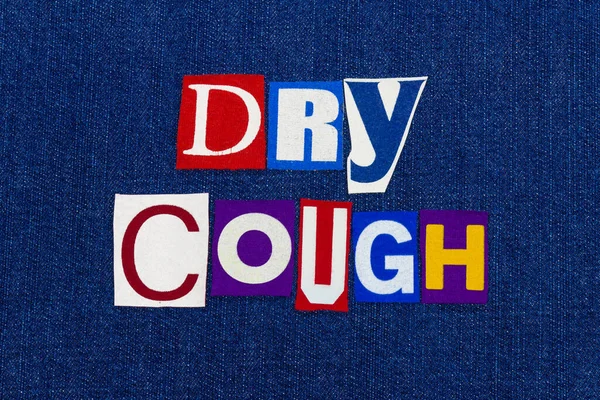 DRY COUGH Coronavirus COVID-19 symptom, word text collage, worldwide pandemic flu virus information, colorful letters on blue denim, horizontal aspect