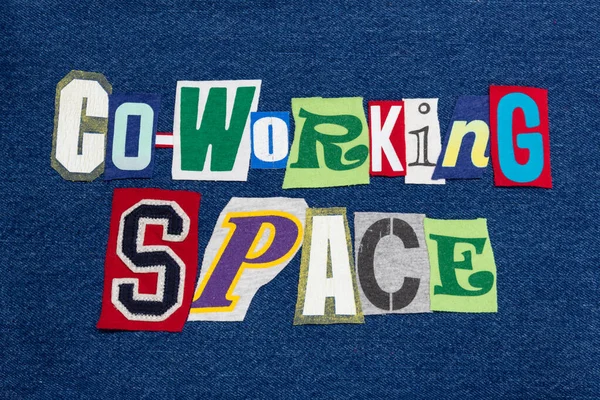 CO-WORKING SPACE text word collage colorful fabric on blue denim, work community, horizontal aspect