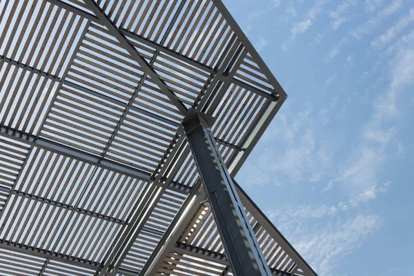 Overhead shade structure, metal and wood construction, horizontal aspect