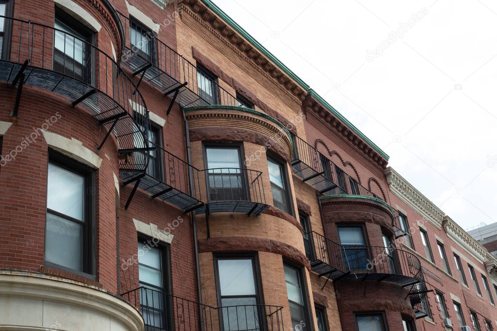 Beautiful brick brownstones displaying a variety of beautiful and ornate architectural details. horizontal aspect