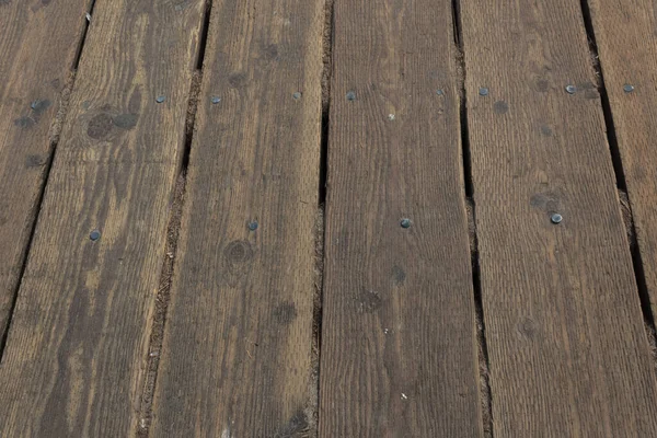 Straight view of wood decking boards on the Santa Monica Pier, horizontal aspect