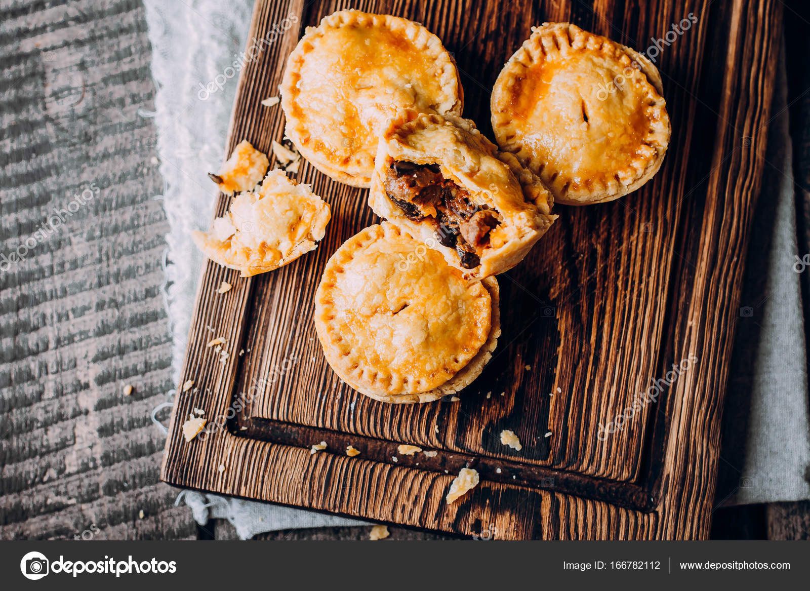 Australian meat pies on wooden Stock Photo by ©AnikonaAnn 166782112