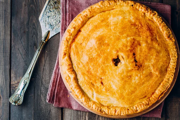 Fresh Meat pie on wooden board — Stock Photo, Image