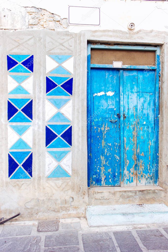 Old door facade in city of Rethymno, Crete, Greece