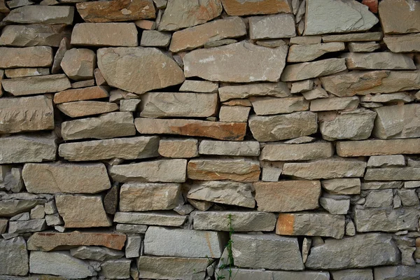 Un frammento di un muro di pietra arenaria — Foto Stock