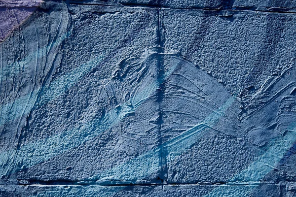 화강암 벽돌에서 일부가 파란색으로칠 해졌다 — 스톡 사진