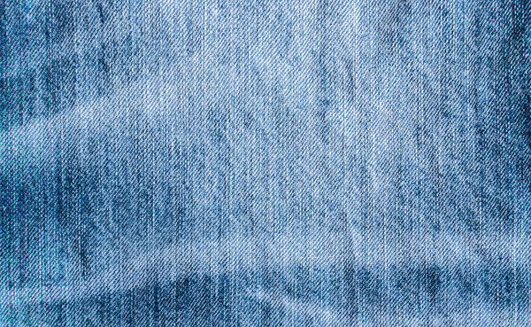 Текстура синих джинсов и стежков

