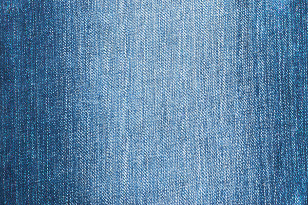 Текстура синих джинсов и стежков
