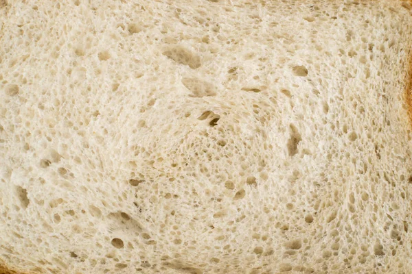 Slice of Bread on an Old Cutting Board Background — Stock Photo, Image