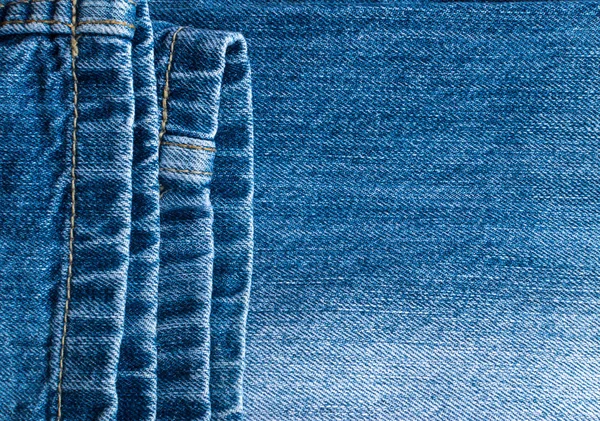 Текстура синих джинсов и стежков — стоковое фото