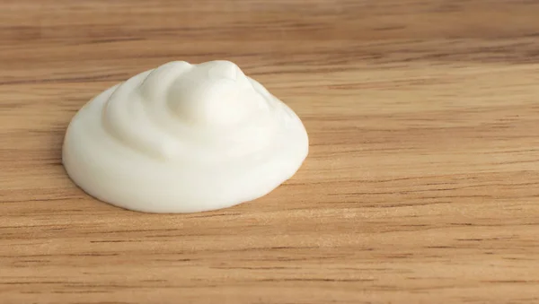 Sour Cream Swirl on a Wooden Background — Stock Photo, Image