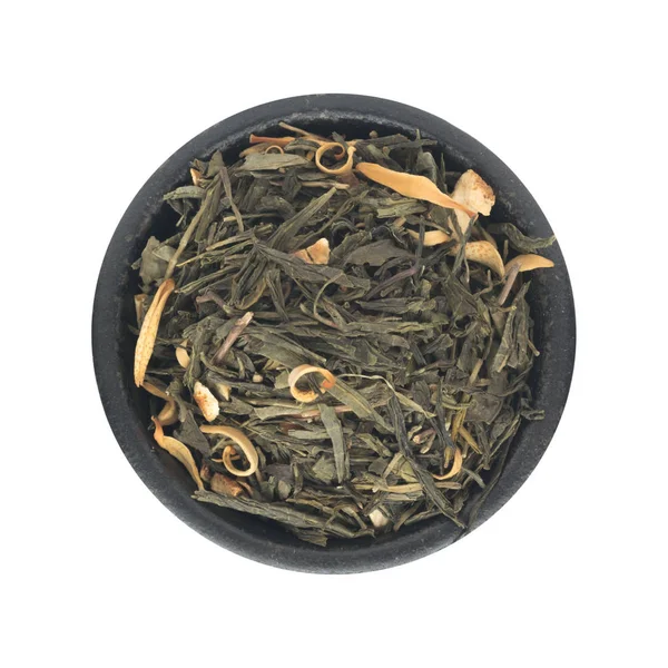 Hromadu suchého zeleného čaje s přísadami — Stock fotografie