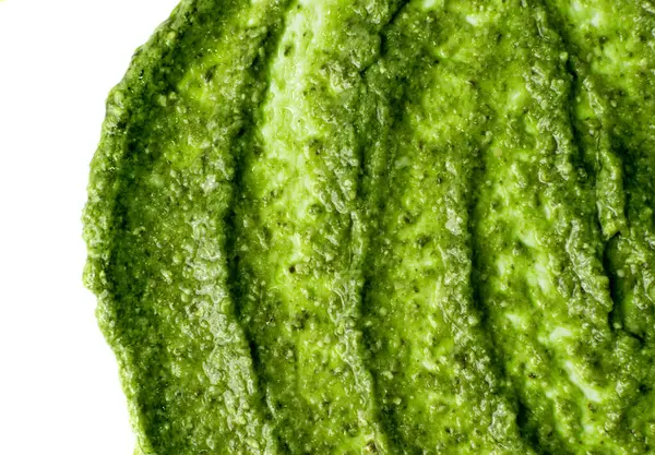 Frersh italian pesto sauce spread green texture background — Stock Photo, Image