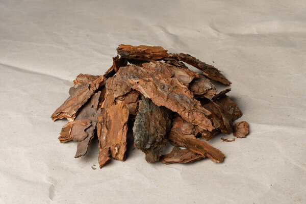 Heap of Pine Tree Bark Chip on Old Paper Background