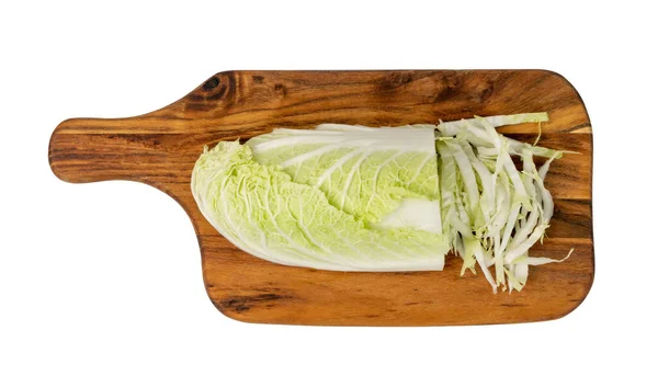 Chopped Chinese Cabbage, Napa Cabbage or Wombok on Wood Cutting Board Background. Fresh Green Sliced Cabbage Salat on Wooden Chopping Board Isolated on White — Stock Image Chopped Chinese Cabbage Napa Cabbage Wombok Wood Cutting Board Background Royalty Free Stock Photos