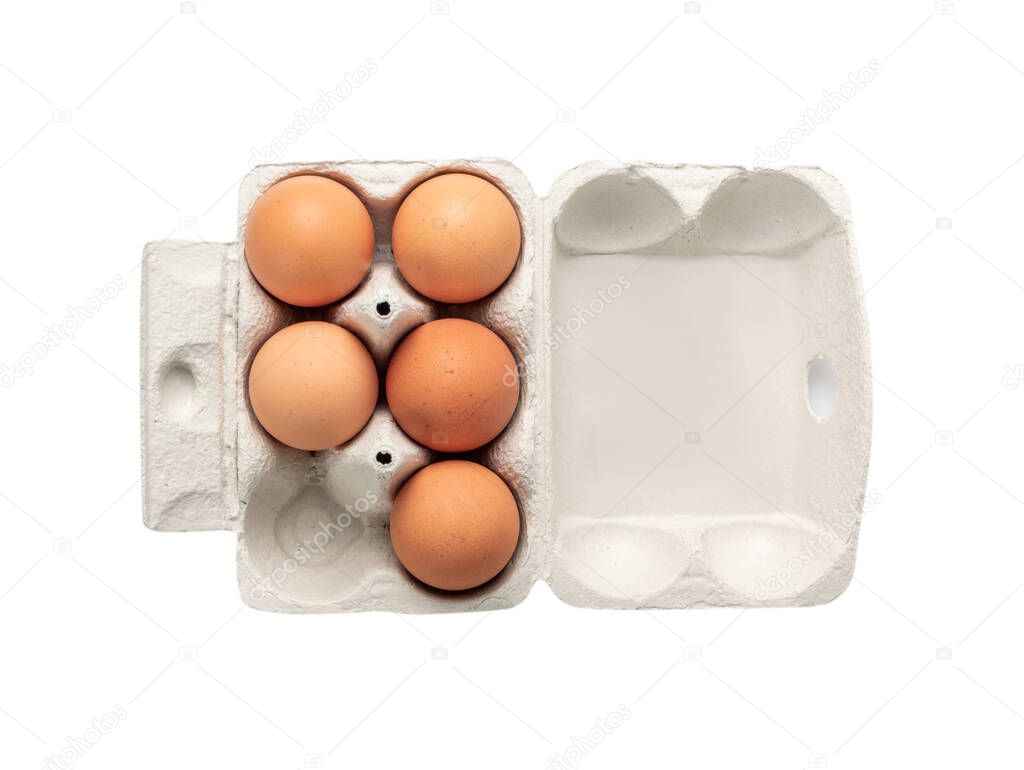 Open egg box with five brown eggs isolated on white background with clipping path. Fresh organic chicken eggs in carton pack or egg container top view