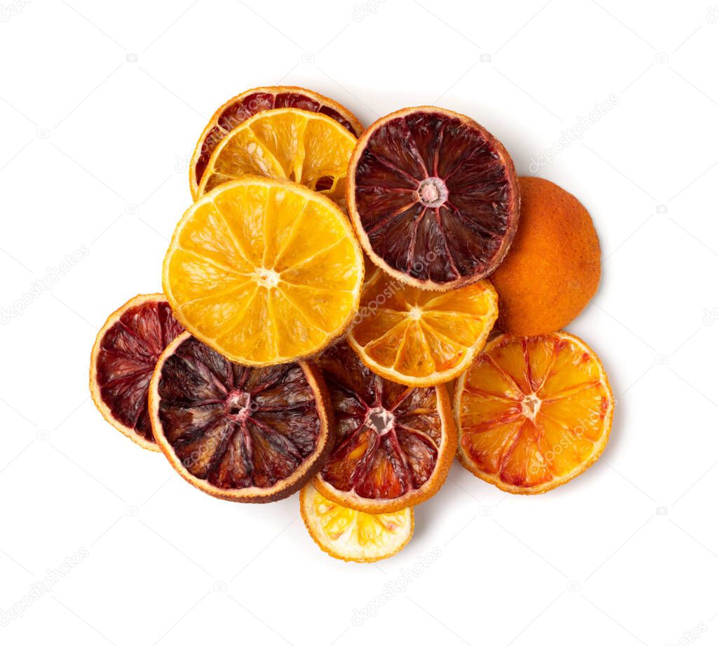 Dried slices of orange and blood orange isolated on white background. Dry lemon, tangerine and sicilian orange top view