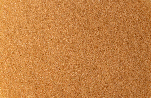 Куча коричневого сахарного фона с копировальным пространством. Сырой неочищенный тростниковый сахар рисунок сверху и плоский узор
