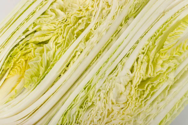 Half of Chopped Chinese Cabbage, Napa Cabbage or Wombok Texture Background. Fresh Green Sliced Cabbage Salat Pattern — Stock Image Half Chopped Chinese Cabbage Napa Cabbage Wombok Texture Background Fresh Royalty Free Stock Photos