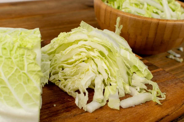Heap of Chopped Chinese Cabbage, Napa Cabbage or Wombok on Wooden Cutting Board Background. Fresh Green Sliced Cabbage Salat — Stock Image Heap Chopped Chinese Cabbage Napa Cabbage Wombok Wooden Cutting Board Stock Image