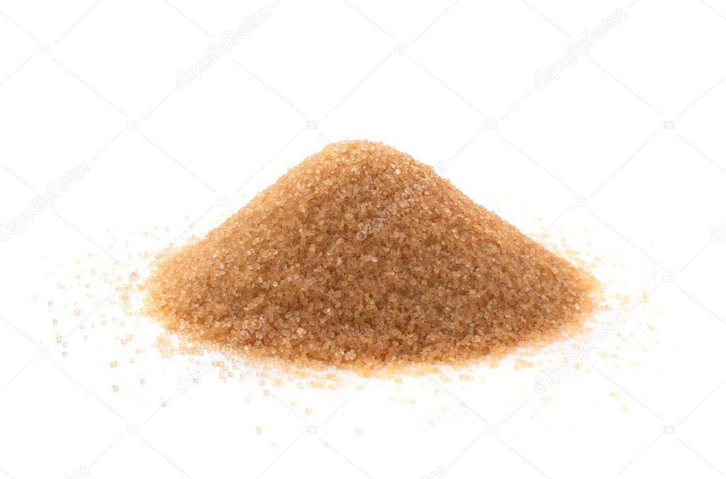 Pile of brown sugar isolated on white background. Raw unrefined cane sugar heap side view